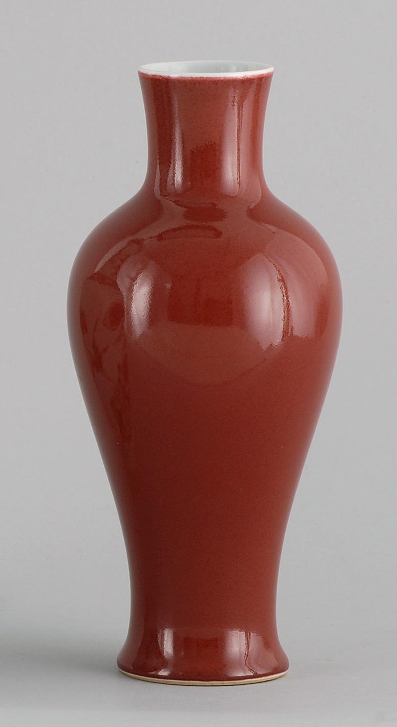 Appraisal: SANG DE BOEUF PORCELAIN VASE In baluster form with six-character