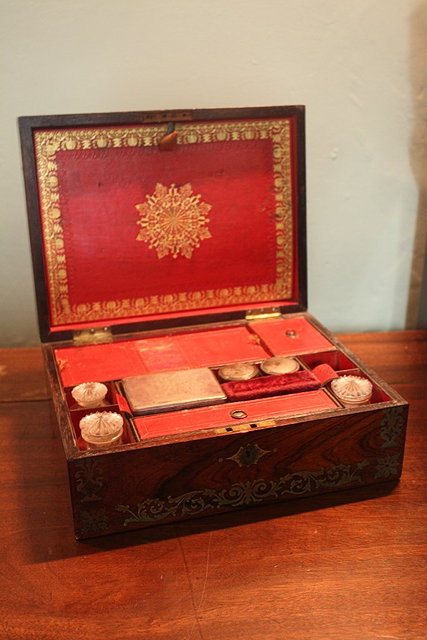 Appraisal: A VICTORIAN ROSEWOOD AND BRASS INLAID VANITY BOX with various