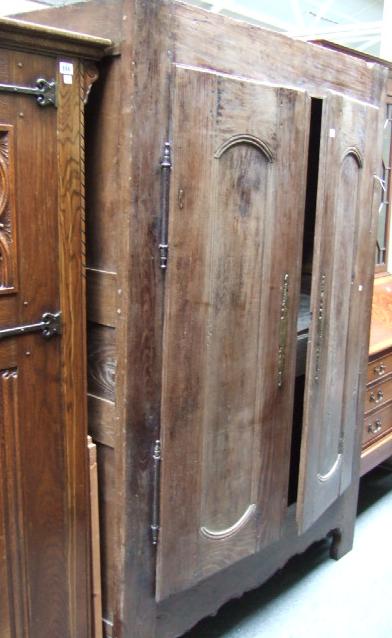 Appraisal: An early th century French oak and chestnut armoire enclosed