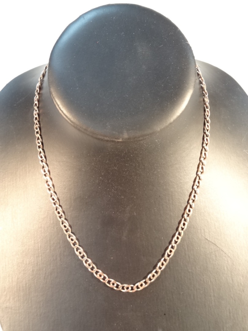 Appraisal: A curb chain necklace with a snap side safety catch