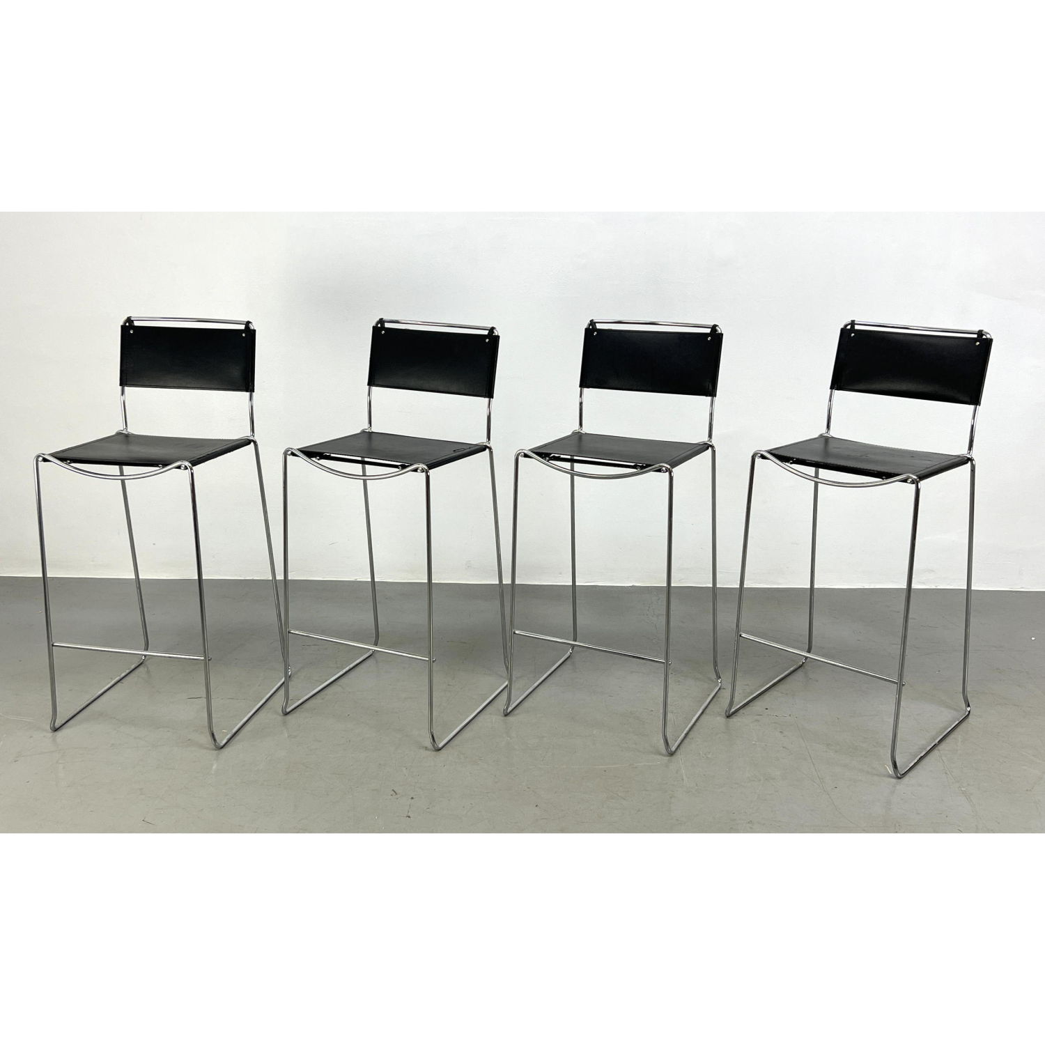 Appraisal: Set Stacking Chrome Tube Frame Bar Stools Black Leather Sling