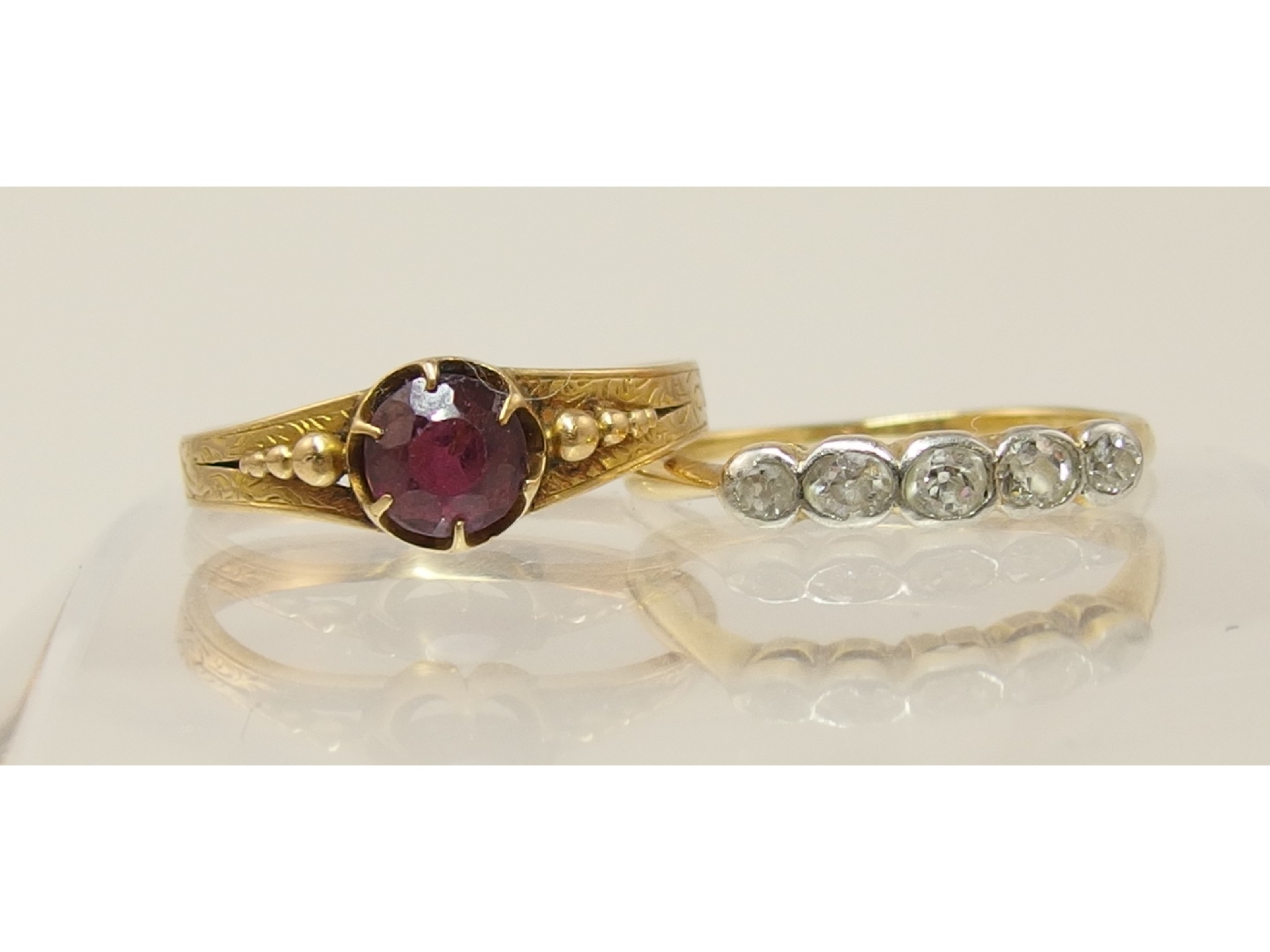 Appraisal: A yellow metal five stone diamond ring together with a