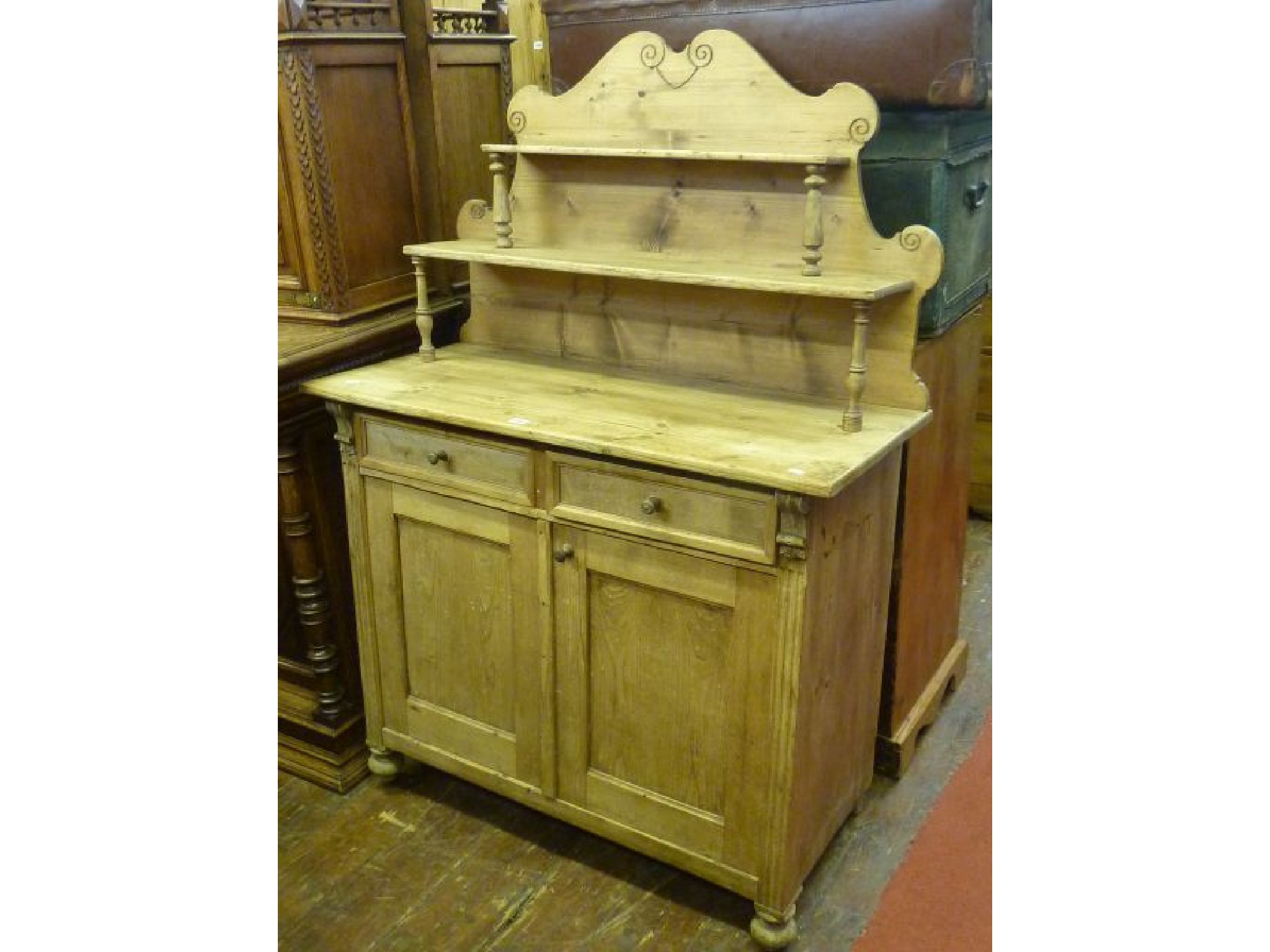 Appraisal: A th century continental stripped and waxed pine chiffonier the