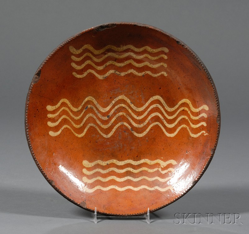 Appraisal: Redware Plate with Yellow Slip Bacon Strip Decoration America early