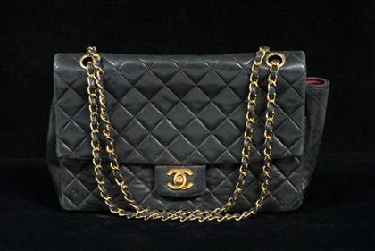 Appraisal: Chanel black quilted purse s With CC logo turnlock closure