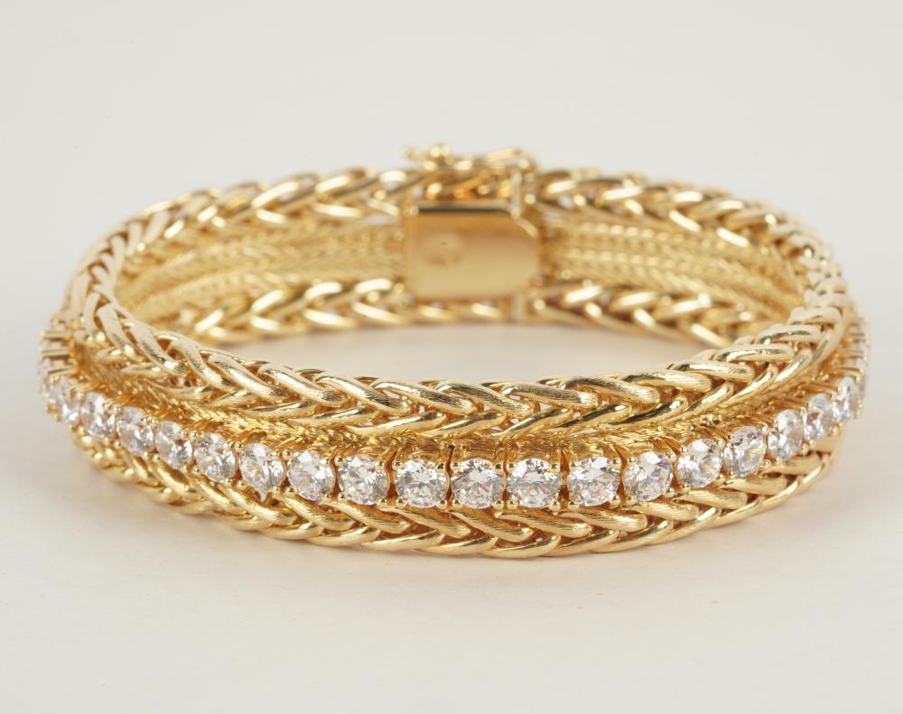 Appraisal: KARAT YELLOW GOLD DIAMOND SIMULANT BRACELETcontaining round brilliant cut diamond