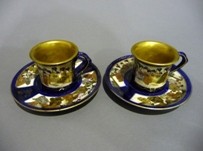 Appraisal: A pair of Japanese Satsuma cups and saucers enriched with