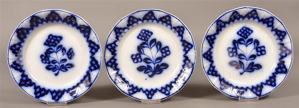 Appraisal: Flow Blue Ironstone Skeleton Flower Plates Three Flow Blue Ironstone