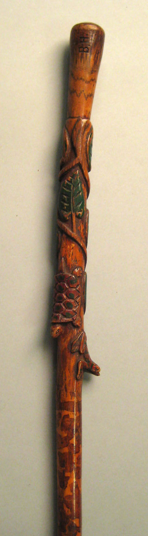 Appraisal: Carved and polychrome decorated cane initialed B H with frog