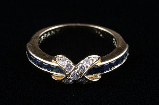 Appraisal: TIFFANY CO K YELLOW GOLD SAPPHIRE AND DIAMOND RING channel-set