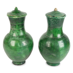 Appraisal: A Pair of Chinese Green-Glazed Terracotta Lidded Hu-Form Jars Tang