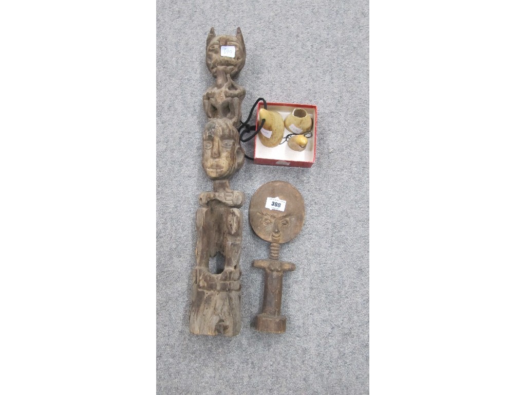 Appraisal: Lot comprising two ethnic carvings and three whales teeth