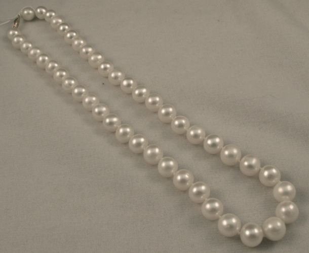 Appraisal: PEARL AND FOURTEEN KARAT GOLD NECKLACE strung with white pearls