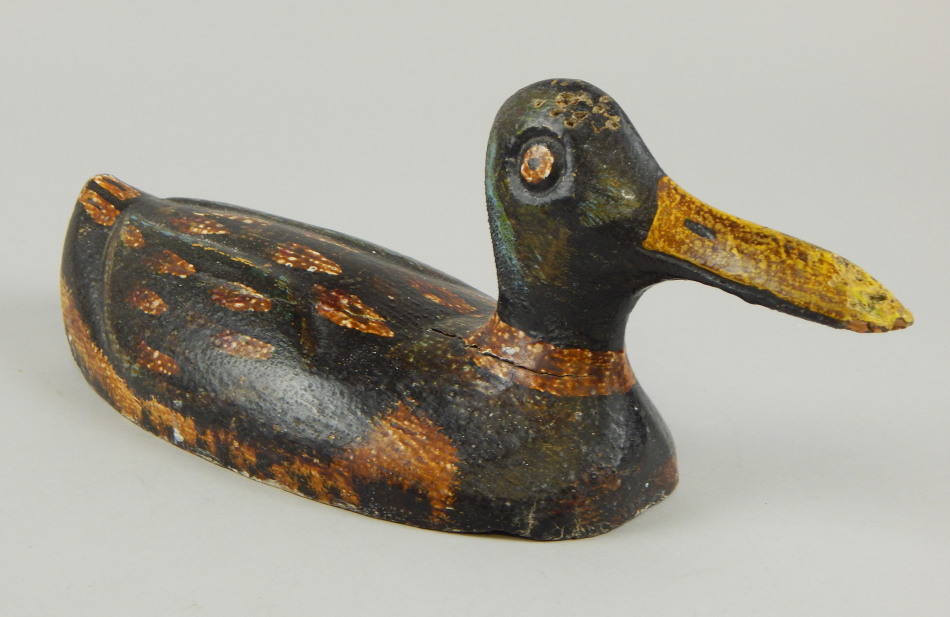 Appraisal: An early thC painted Folk Art decoy duck in spotted