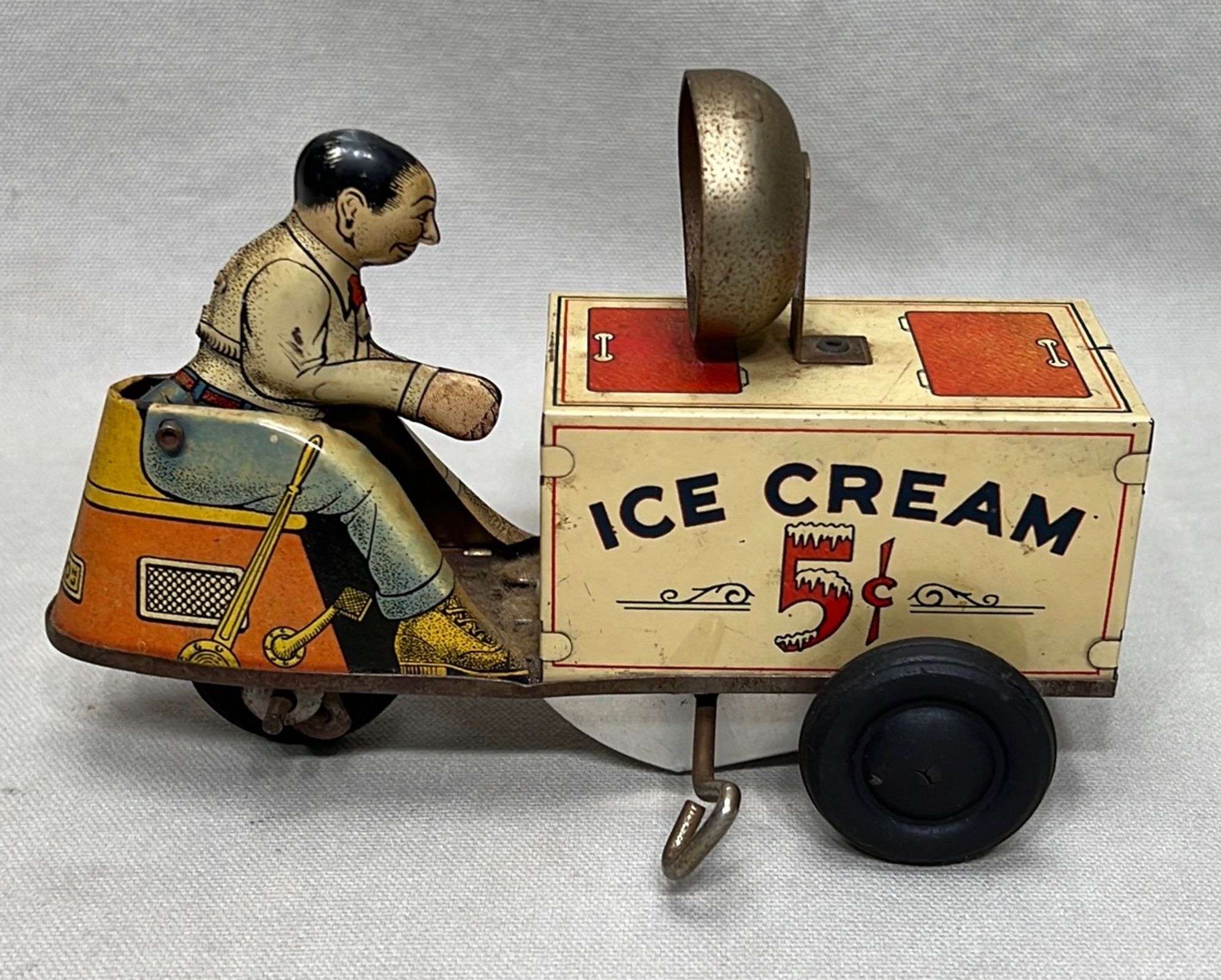 Appraisal: Courtland tin wind-up ice cream cart toyearly th century mechanism