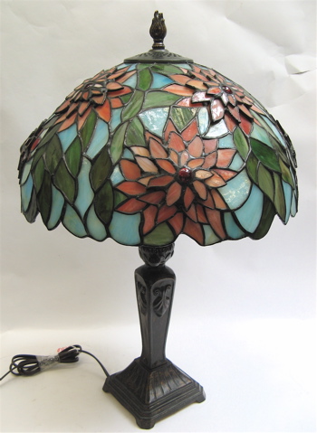 Appraisal: STAINED AND LEADED GLASS TABLE LAMP the colorful shade having