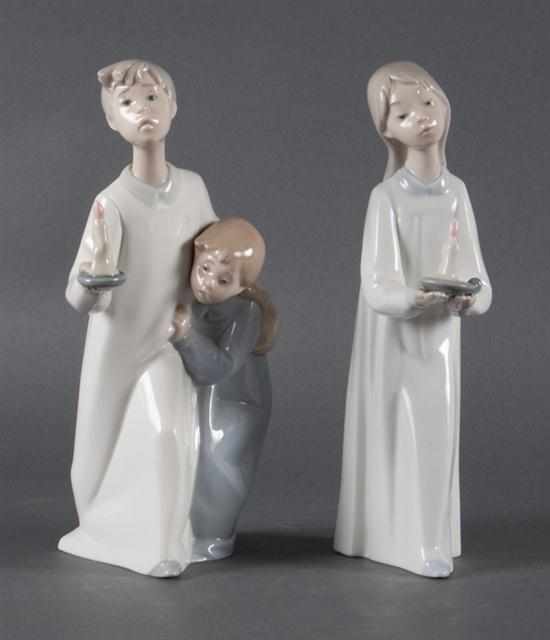 Appraisal: Two Lladro porcelain figural groups th century girl in nightshirt