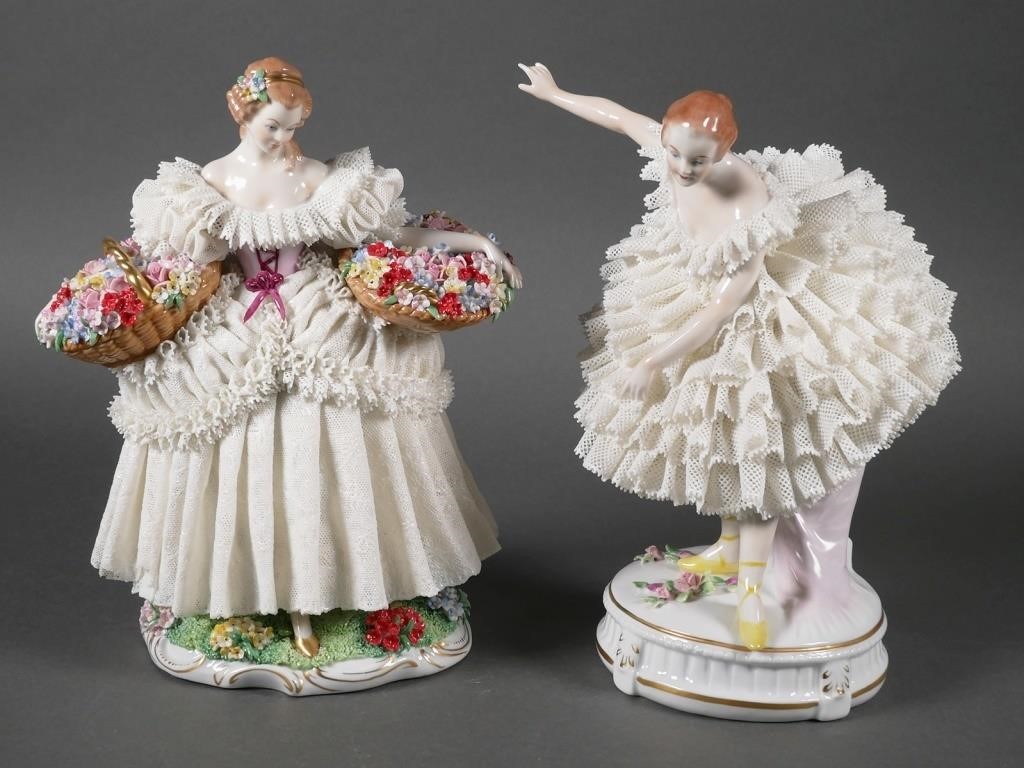 Appraisal: Two Dresden Sitzendorf Germany porcelain lace figurines Woman holding two