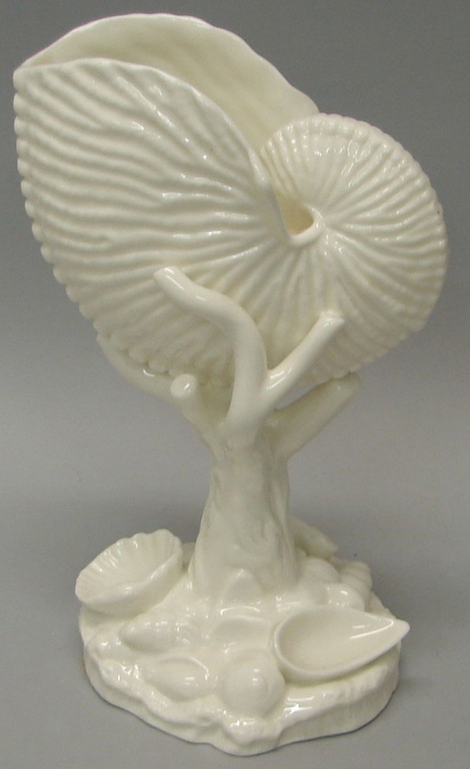 Appraisal: Compote features large shell form supported by a vine form