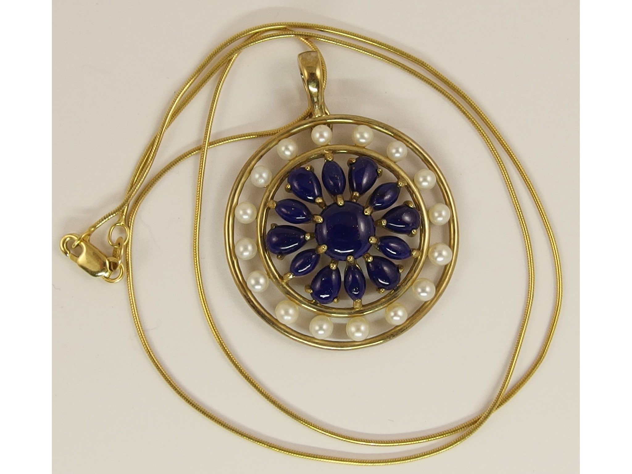 Appraisal: A ct gold lapis lazuli and pearl set pendant and