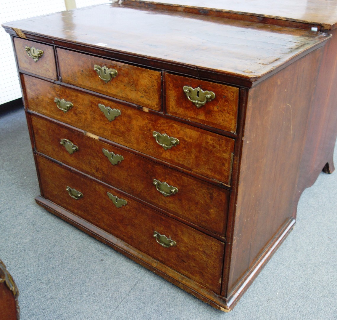 Appraisal: A early th century figured walnut chest of three short