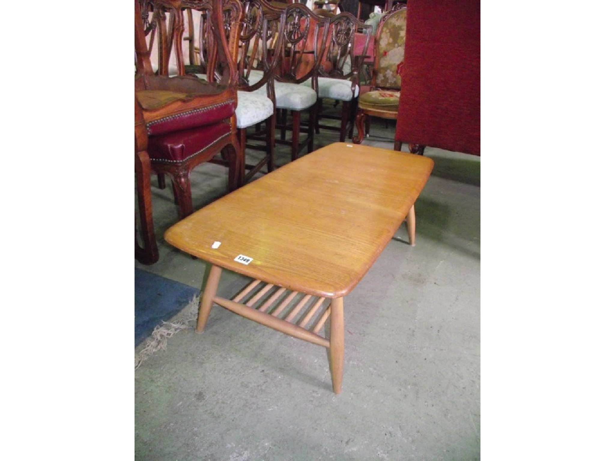 Appraisal: An Ercol light elm and beechwood occasional table of rectangular