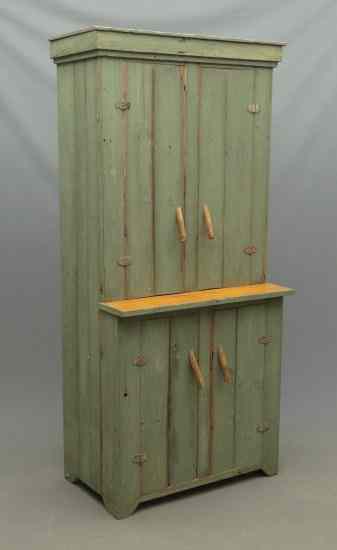 Appraisal: Primitive four door cupboard in green paint Note unusual handles