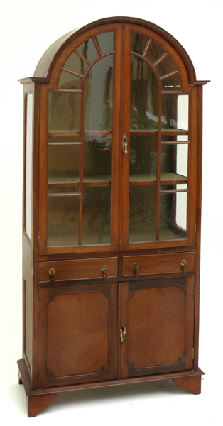 Appraisal: AN ASTRAGAL GLAZED MAHOGANY DISPLAY CABINET The break arch pelmet