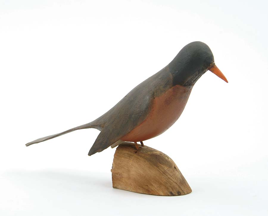 Appraisal: CARVED AND PAINTED ROBIN Folk art carved robin stands atop