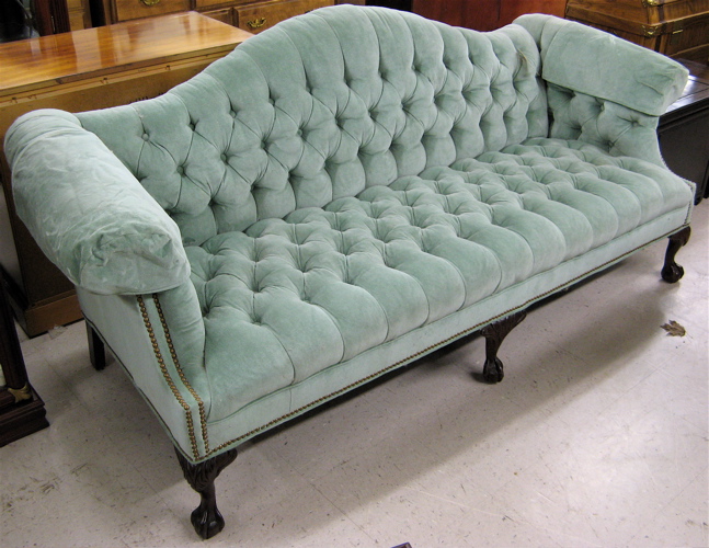 Appraisal: CHIPPENDALE STYLE SOFA American made modern The scroll arm camel-back