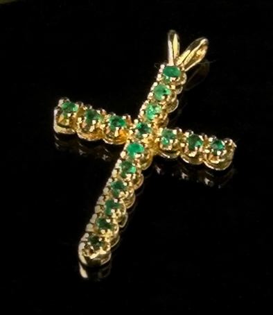 Appraisal: Fourteen-Karat Yellow Gold and Emerald Pendant Cross featuring sixteen round