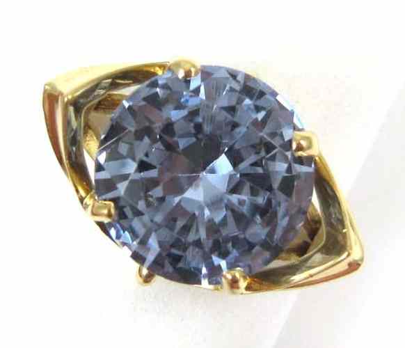 Appraisal: SYNTHETIC BLUE SPINEL SOLITAIRE RING k yellow gold set with