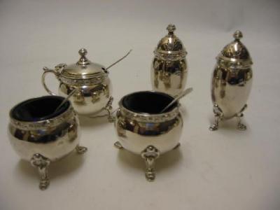 Appraisal: A FIVE PIECE CRUET SET maker Adie Brothers Birmingham comprising