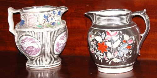 Appraisal: Title Two Polychromed Silver Resist Pitchers one with th century