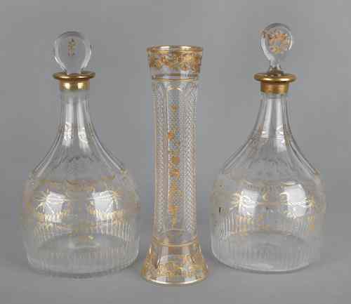 Appraisal: Pair of gilt enamel glass decanters h together with a