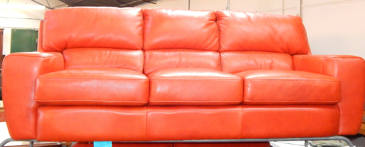 Appraisal: A red hide three seater sofa cm long cm deep