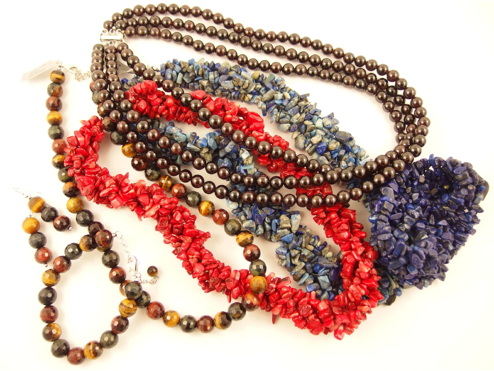 Appraisal: A collection of semi-precious beads to include tigerseye coral lapis