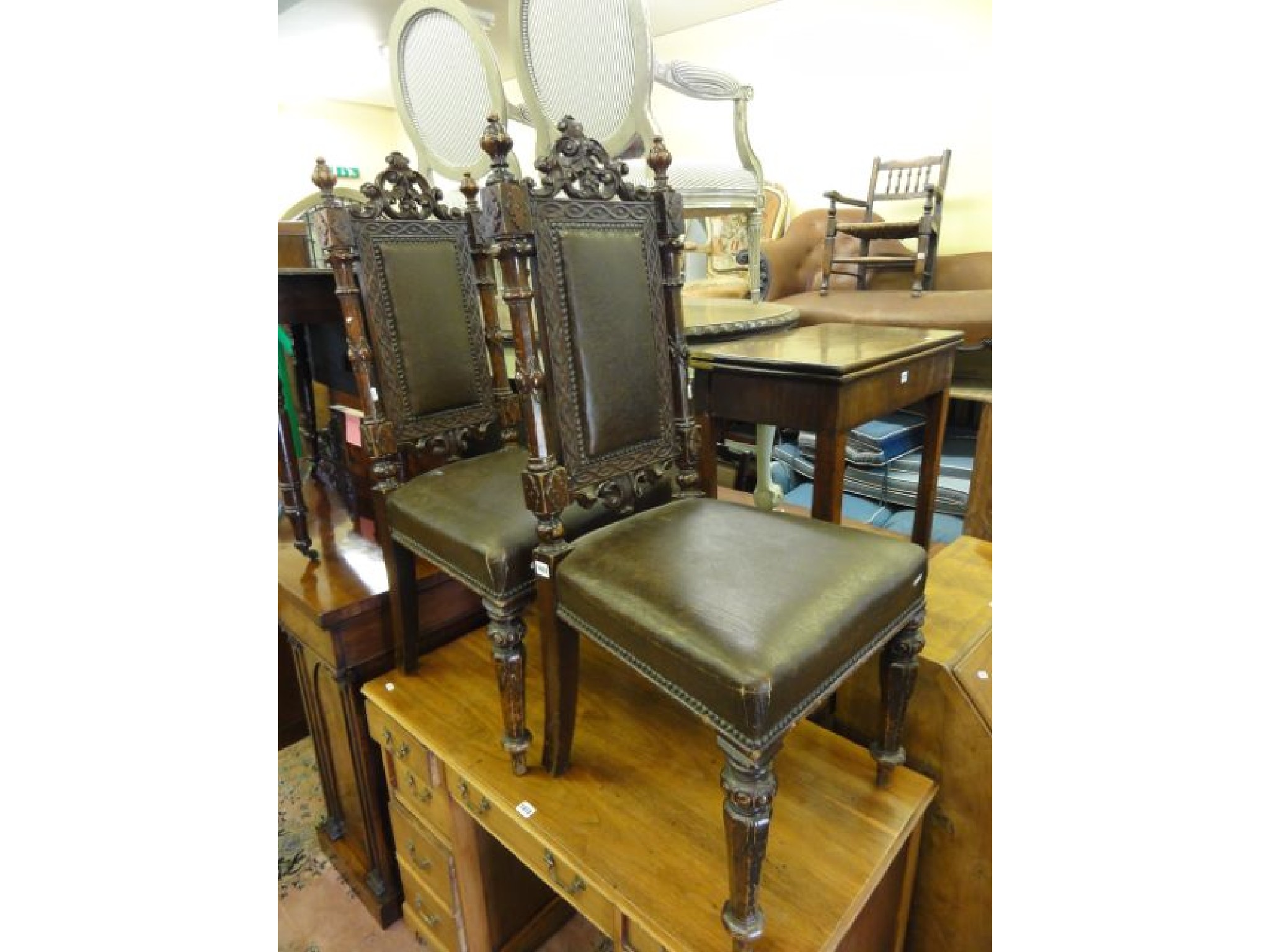 Appraisal: A pair of Victorian Gothic Revival oak side chairs with