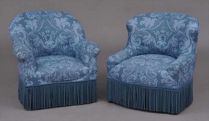 Appraisal: TWO VICTORIAN-STYLE UPHOLSTERED CLUB CHAIRS Each with damask-pattern printed upholstery