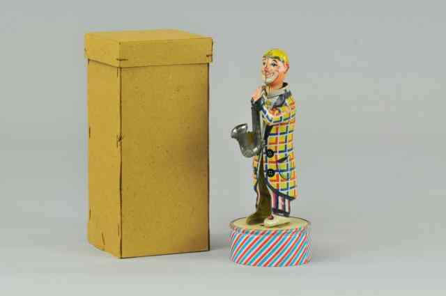 Appraisal: DISTLER BOXED SAX PLAYER Germany lithographed tin standing figure holds