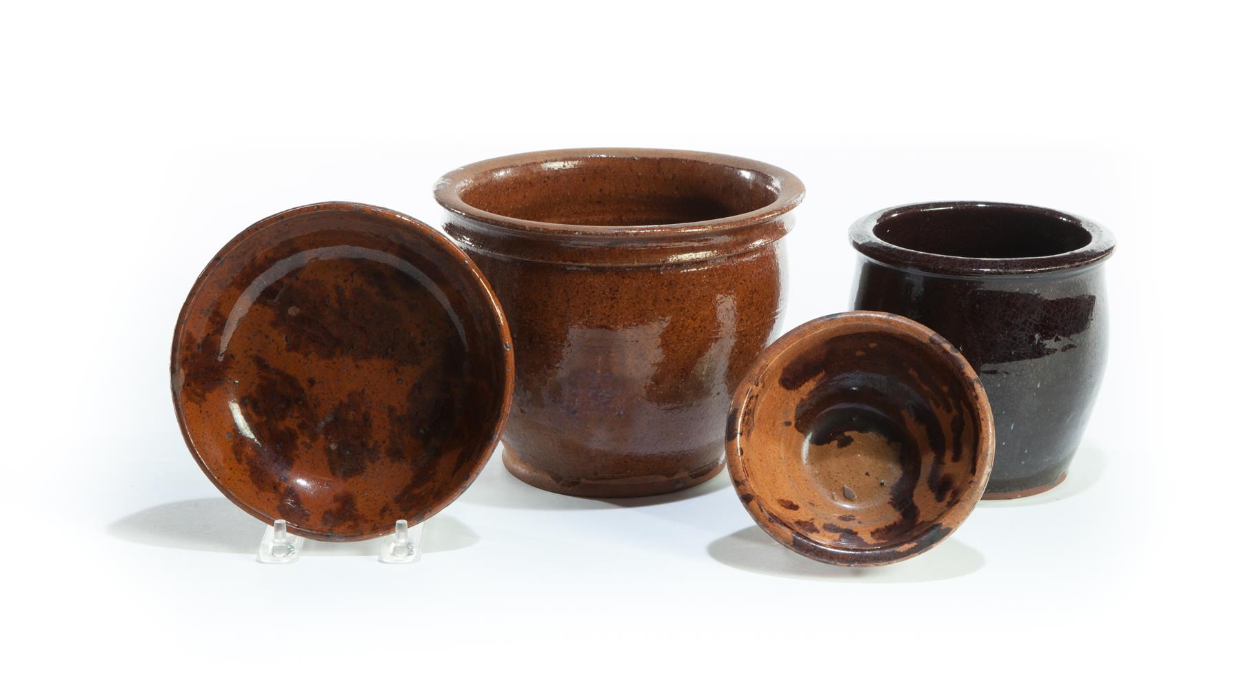 Appraisal: FOUR PIECES OF AMERICAN REDWARE Nineteenth century Two storage jars