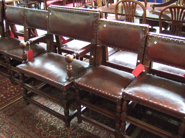 Appraisal: A matched set of sixteen North European oak dining chairs