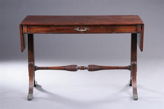 Appraisal: EDWARDIAN REGENCY STYLE MAHOGANY SOFA TABLE early th century Trestle-form