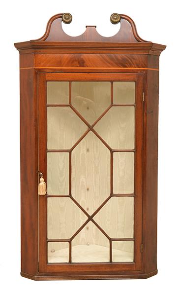 Appraisal: A GEORGE IV MAHOGANY CORNER WALL CABINET with a single