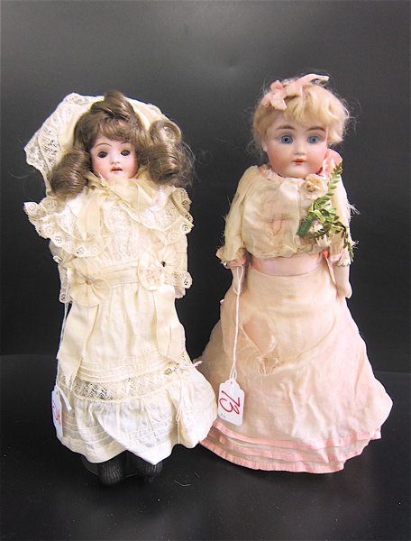 Appraisal: TWO BISQUE SHOULDER HEAD DOLLS one with blond wig blue