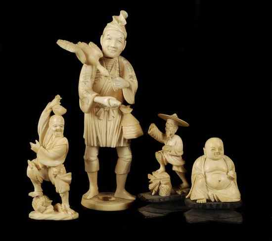 Appraisal: A group of four Japanese okimono ivory figures comprising a