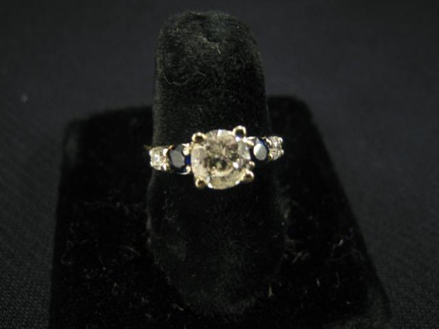 Appraisal: Sapphire Diamond Ring carat center stone flanked by diamond rich