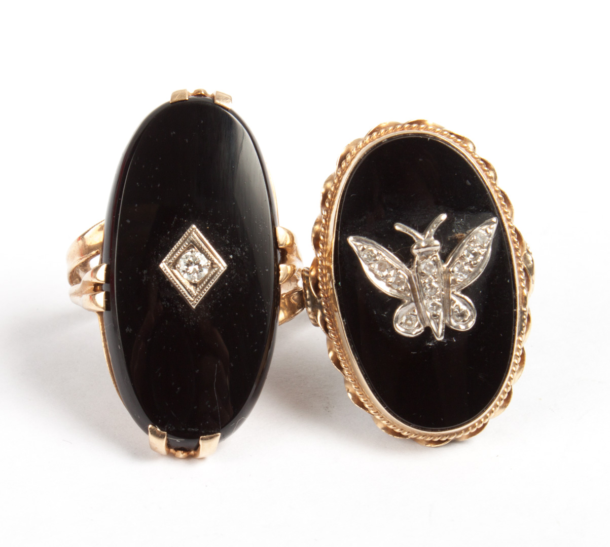 Appraisal: Two gold black onyx and diamond rings large oval-shaped black