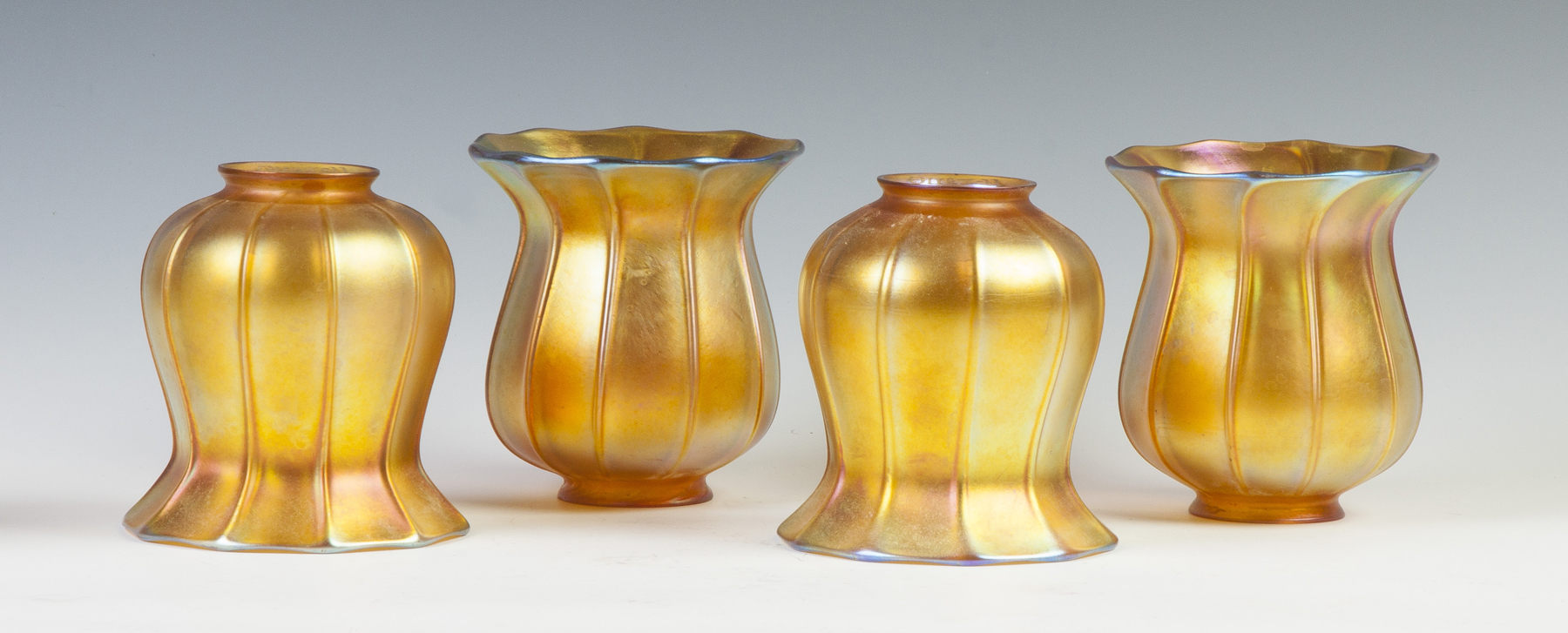 Appraisal: Set of Four Quezal Ribbed Shades Early th cent Signed