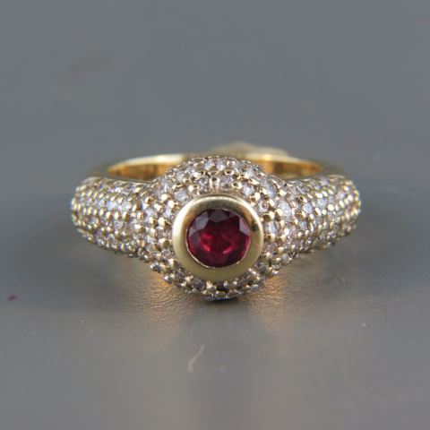 Appraisal: Ruby Diamond Ring rich round gem weighing carat surrounded by